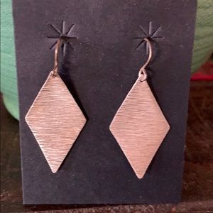 Sterling silver earrings by indigenous Taos dsgnr.